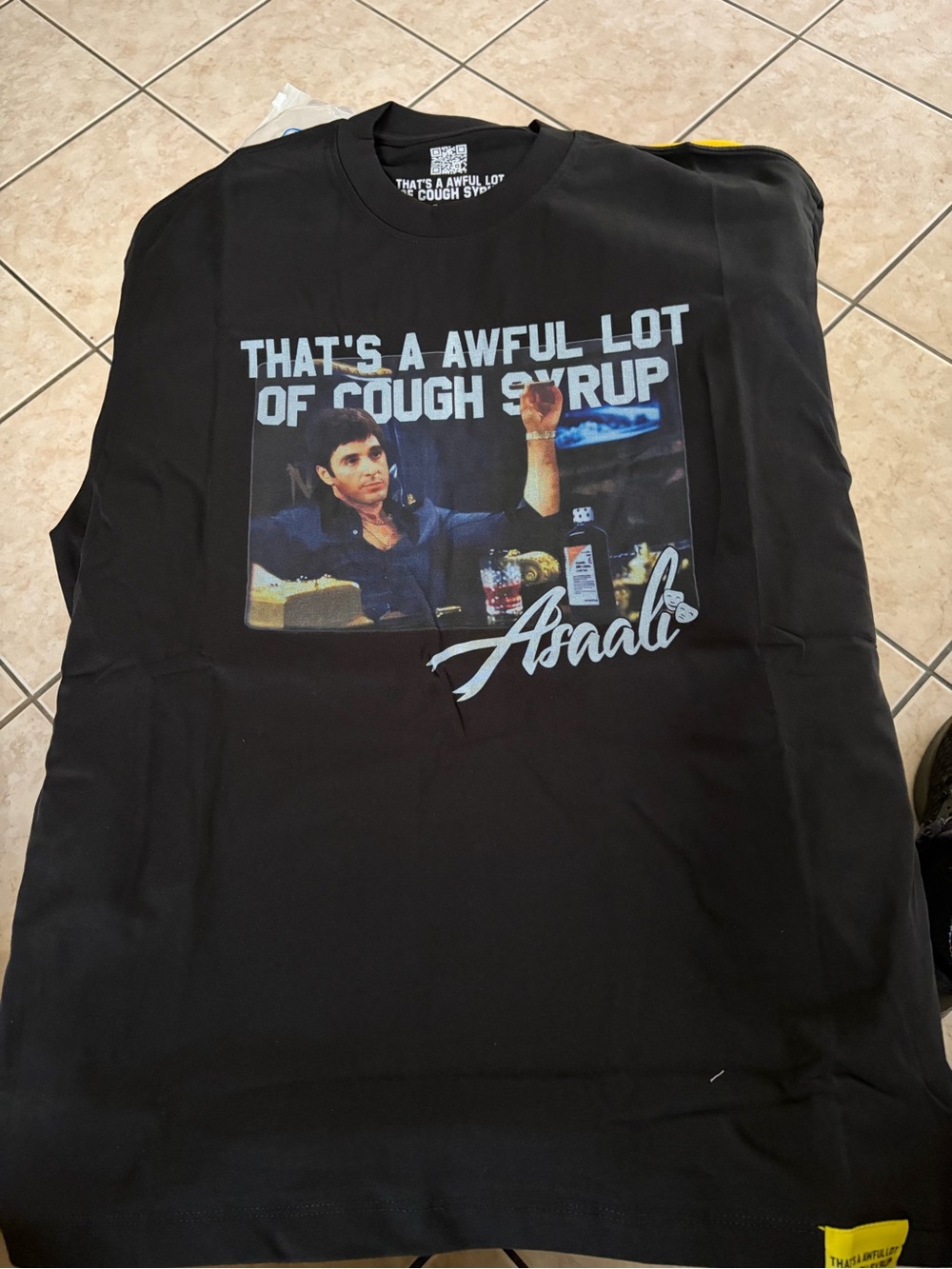 Black Graphic Tee with 'That's a Awful Lot of Cough Syrup' Print